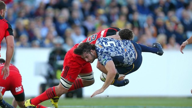 Smashed: Sam Carter is tackled by Kieran Read.