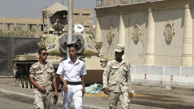 Police and soldiers outside Egypt's Tora prison.