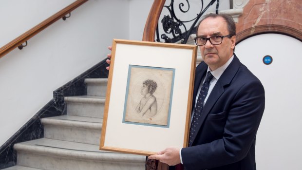 Christie's director Nick Lambourn holds a pencil drawing of Toulgra.