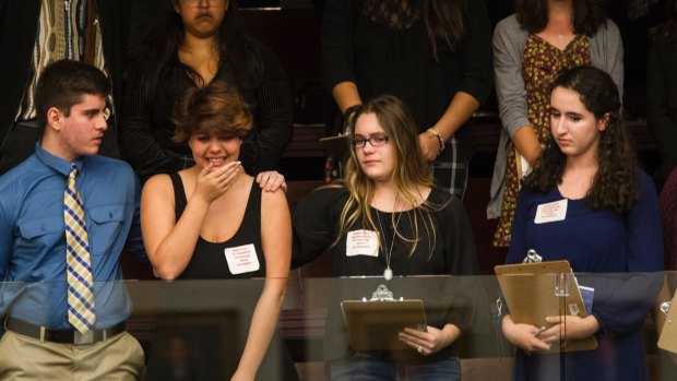 Sheryl Acquarola, a from Marjory Stoneman Douglas High School is overcome with emotion in the House of Representatives.