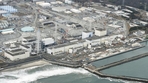 The crippled Fukushima No.1 nuclear plant in Okuma town switched on a giant refrigeration system on Thursday to create an unprecedented underground ice wall around its damaged reactors. 