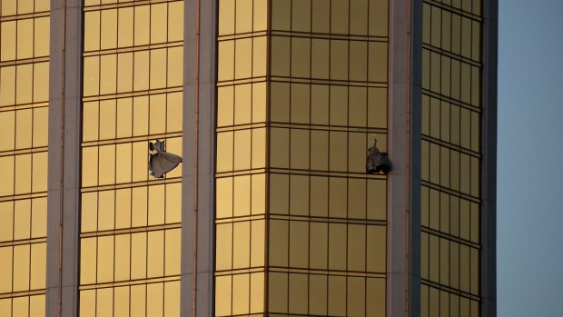 The broken windows of the shooter's room at the Mandalay Bay resort and casino on the Las Vegas Strip following a mass shooting at a music festival below.