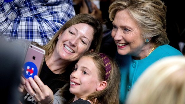 Photo op: Clinton gets a selfie with supporters in Seattle on Friday.