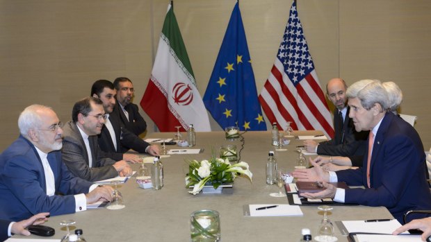 US Secretary of State John Kerry speaks with Iranian Foreign Minister Mohammad Javad Zarif in Geneva on Saturday.