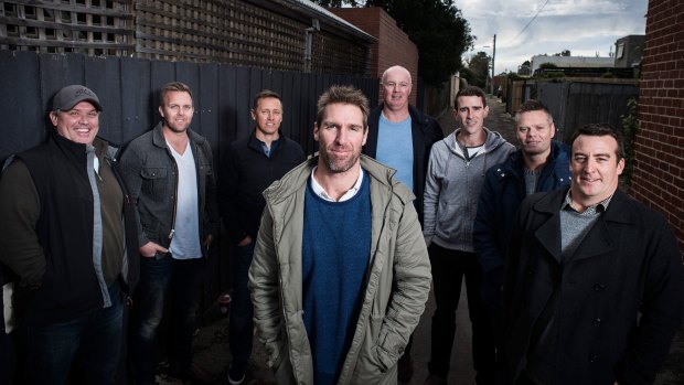 Port Adelaide list manager Jason Cripps with the men who saved his life, (L-R) Geoff Parker, Blair Hartley, Matt Clarke, Chris Drain, Michael Regan, Anthony Parkin and Luke Williams.