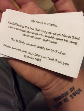 Charlie Camero had to make up business cards explaining why he was forced to use the women's bathroom.