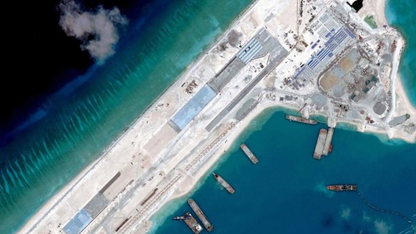 Reclamation: A satellite image taken in April shows a Chinese airstrip under construction on Fiery Cross Reef in the South China Sea.