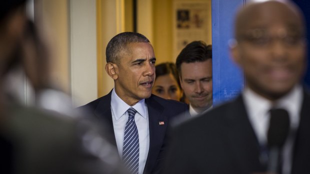 Obama arrives for his first press conference since the elections.