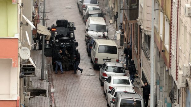 Security forces take up positions during the operation against two female militants in Istanbul.