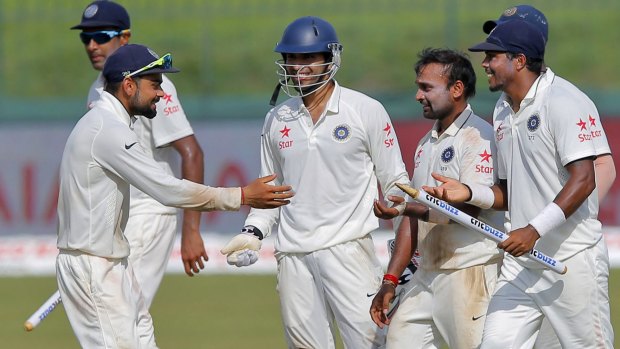 Indian captain Virat Kohli celebrates with his teammates after defeating Sri Lanka in the third Test to clinch the series 2-1.