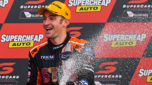 Corker: Will Davison of Tekno Autosports Holden celebrates on the podium after winning the Bathurst 1000 at Mount Panorama.