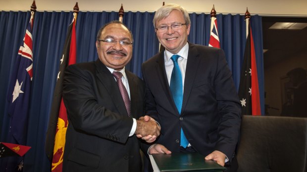 Papua New Guinea's Prime Minister Peter O'Neill and then Australian prime minister Kevin Rudd sign the Manus Island asylum seeker agreement in 2013.