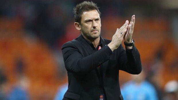 Better effort: Tony Popovic applauds the crowd after the final whistle.