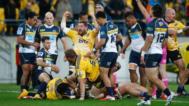 Dane Coles of the Hurricanes celebrates the try scored by Ardie Savea against the Brumbies.