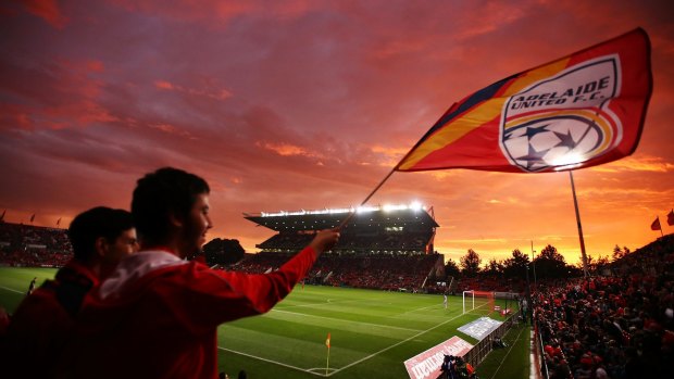 Red dawn: Adelaide United fans look on at Hindmarsh Stadium.