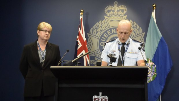 Queensland Deputy Commissioner Steve Gollschewski addresses the media with State Crime Command Detective Superintendent Cheryl Scanlon, after a 38-year-old senior constable was charged with the murder of his baby son.