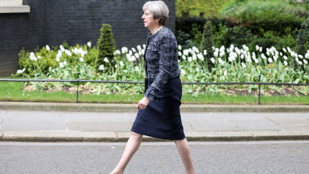 Theresa May, U.K. prime minister, arrives in 10 Downing Street after meeting Queen Elizabeth II to mark the dissolution of parliament, beginning the formal start to campaigning for the June 8 general electio.