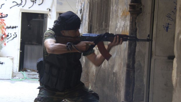 A Free Syrian Army fighter in the Yarmouk refugee camp in September 2013.