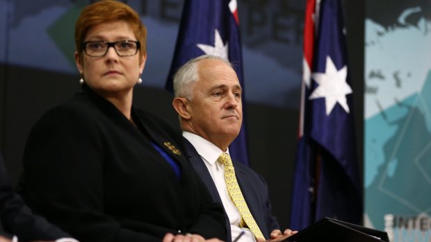 Prime Minister Malcolm Turnbull launches his 2016 Defence white paper with Defence Minister Marise Payne backed by just two Australian flags.