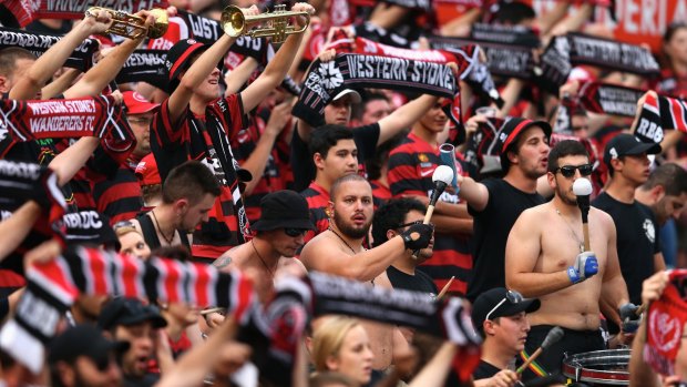 Nothing to see here, move along: Fans enjoy the atmsophere during the round four A-League match between the Western Sydney Wanderers and Perth Glory at Pirtek Stadium.