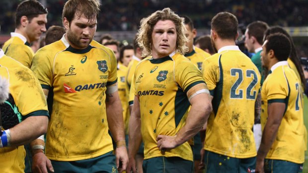 Dejected: The Wallabies, led by skipper Michael Hooper, after the loss against Ireland.