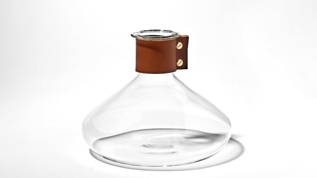 Simon Hasan's <i>Wrap Decanter Boroilicate</i>, glass, honey leather 2012.
