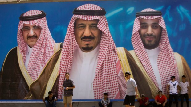A billboard showing King Salman, centre, his son Mohammed bin Salman,  right, and former heir Mohammed bin Nayef in Taif, Saudi Arabia.  