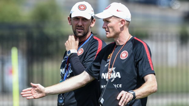 Working as one: Tony Popovic (left) with then assistant coach Hayden Foxe.