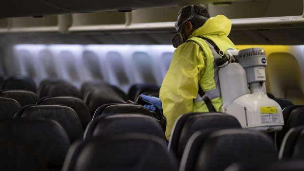 An Air France plane is disinfected at Charles de Gaulle airport in Paris.