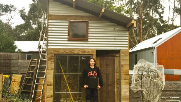 Zephyr Ogden Jones in front of the tiny house he co-built in Daylesford.