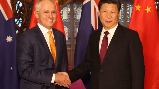 Australian Prime Minister Malcolm Turnbull, left, and Chinese President Xi Jinping shake hands before their meeting in Beijing in April.