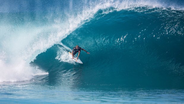 Smooth: Mick Fanning rides to his third world title.