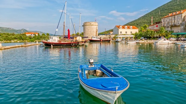 Mali Ston's harbour and the remains of ancient walls and a fortress on the Peljesac Peninsula. 
