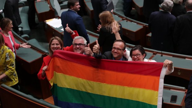 Crossbench MPs celebrate the bill's passage.