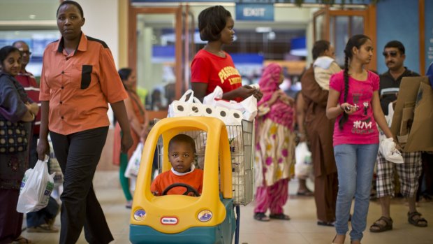 Shoppers visit the reopened Westgate mall on Saturday.
