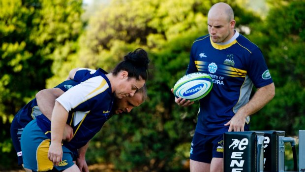 Wallaroos front rower Louise Burrows getting some pointers from Brumbies players Stephen Moore and Ben Alexander in 2014.