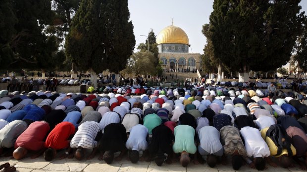 Palestinians pray inside the al-Aqsa Mosque compound.