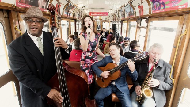 Paige Smith, Adam Dunning, Roger Clark and Anna Mitsikas play on a W-Class tram in Melbourne.