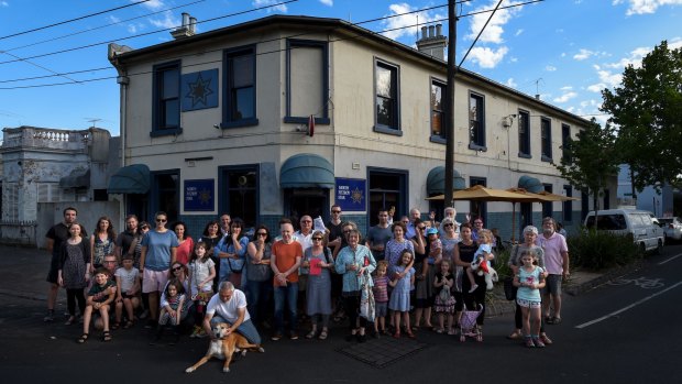 Patrons and neighbours of all ages gather outside the North Fitzroy Star.