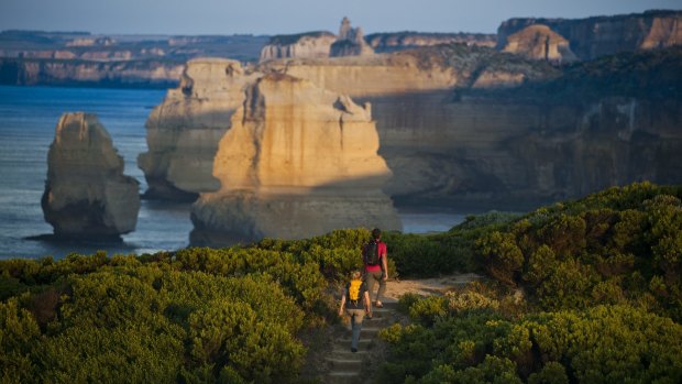 A couple hiking on the Great Ocean Road. 