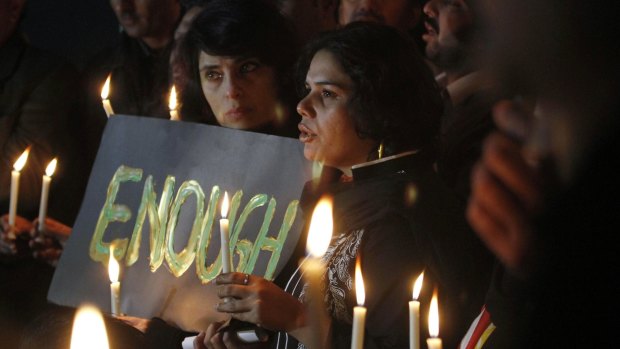 Pakistanis at a candlelit vigil in the nation's capital, Islamabad.