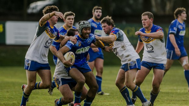 West Belconnen's Andre Niko takes the ball forward.