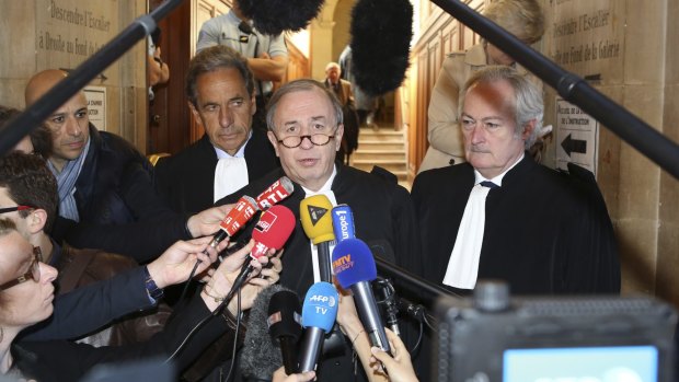 Nicolas Sarkozy' lawyer Pierre Haik, center,  with Thierry Herzog's lawyers on Thursday.