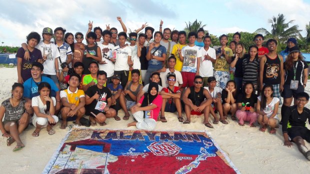 Filipino students land on Pagasa island in the Spratly archipelago to protest against China's incursion into disputed Philippines territories.