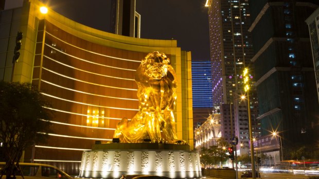 A statue of a lion stands outside MGM Macau casino resort in Macau.