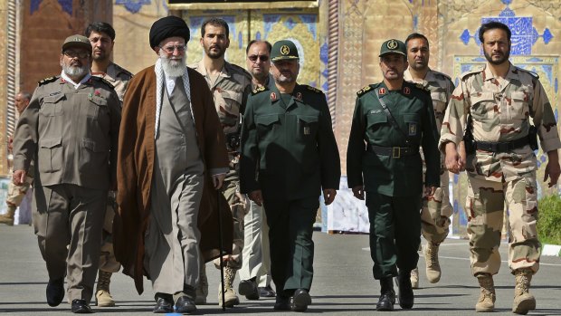 Iran's Ayatollah Ali Khamenei, third from left, the Supreme Leader of the nation which has jailed a <i>Washington Post</i> reporter on unspecified charges and refuses to let his wife and family attend his trial. 