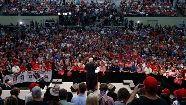 Preaching to the faithful: Trump speaks during a campaign rally.