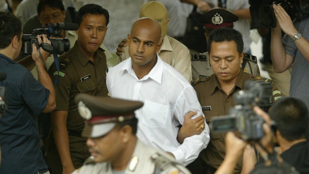 Myuran Sukumaran is escorted to court in Denpasar, Bali, in October 2005.
