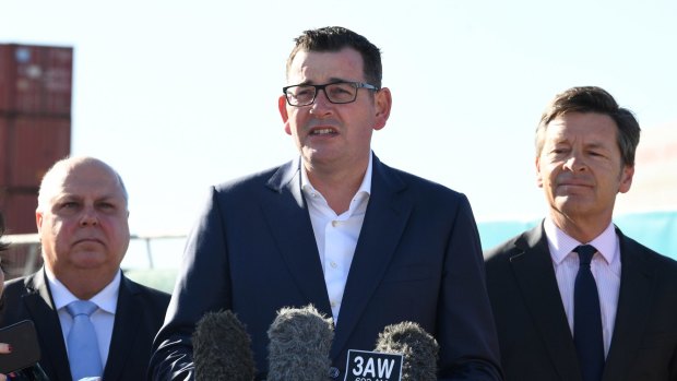 Daniel Andrews with Treasurer Tim Pallas (left) and Roads Minister Luke Donnellan.