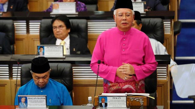 Mr Razak (right) unveils Malaysia's 2017 budget at Parliament in Kuala Lumpur last month.